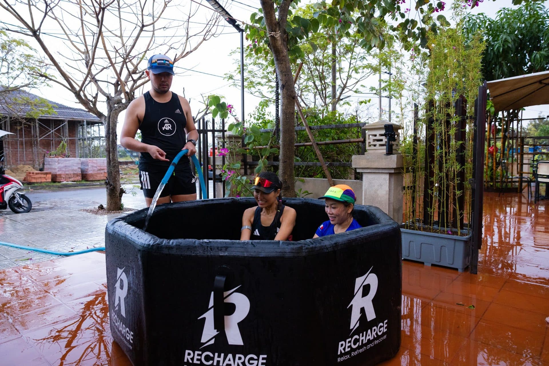 Athletes recovering in ice baths after a hard session