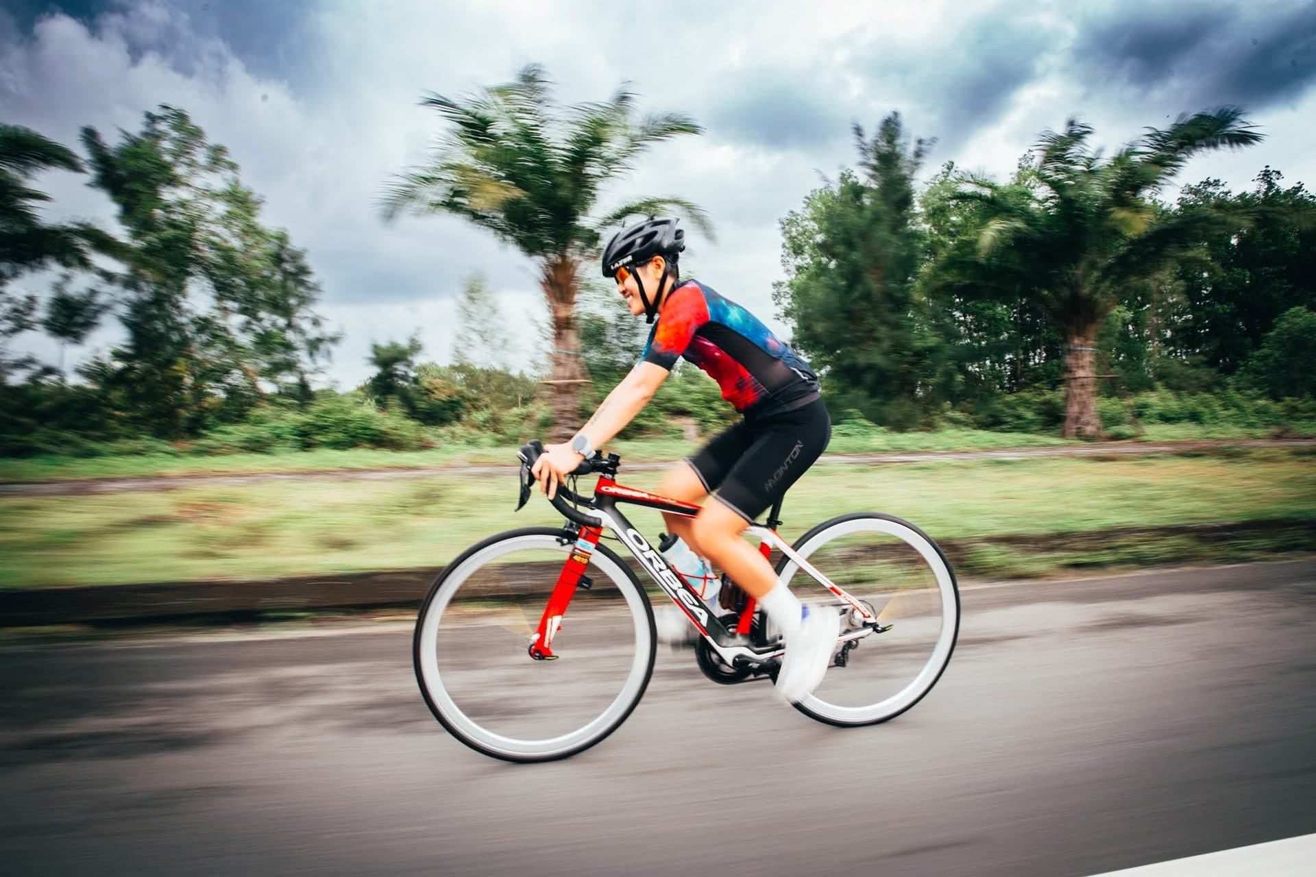 Cyclist at speed on an open road during a camp ride